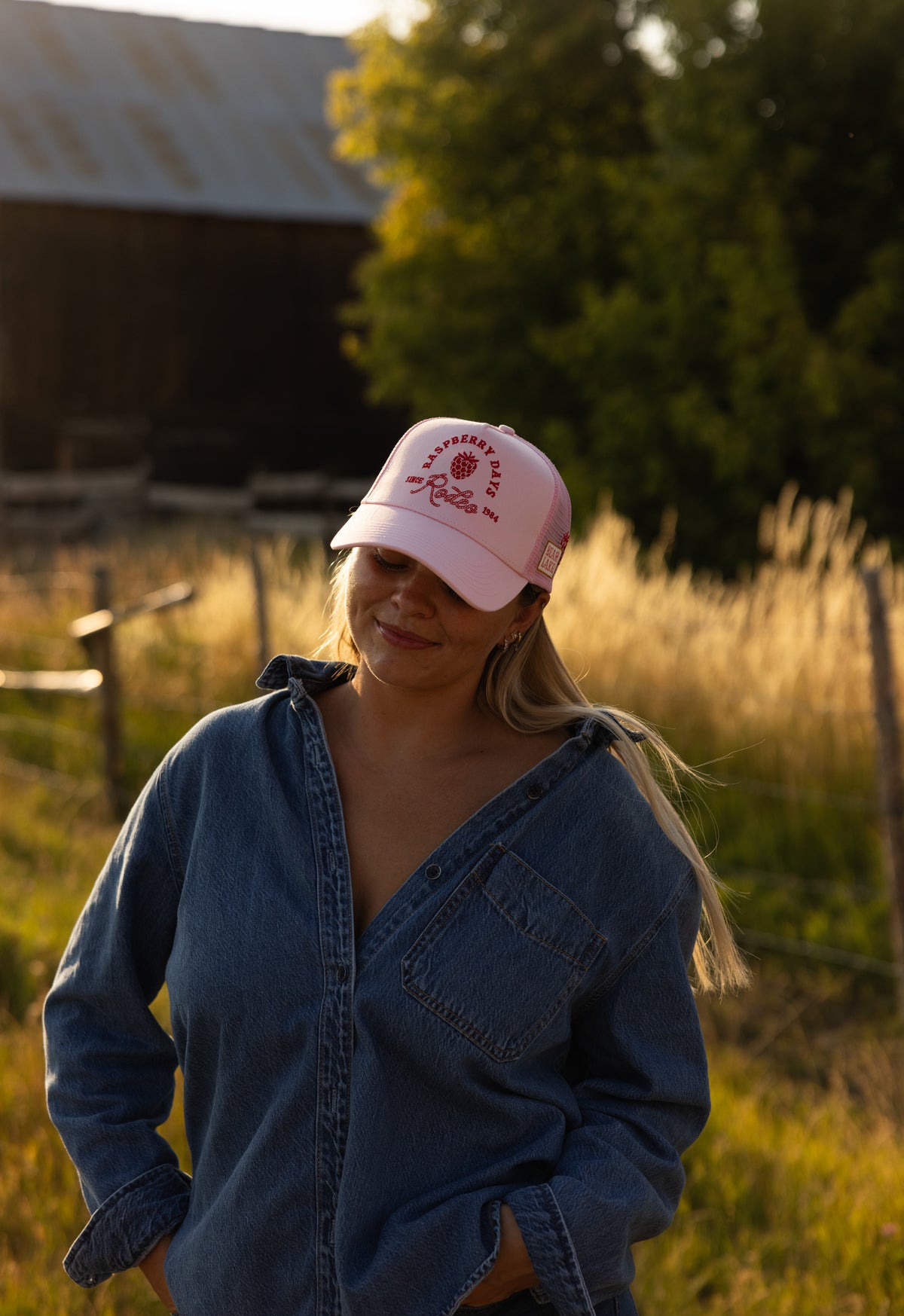 Woman in a Bull River cap and denim jacket outdoors