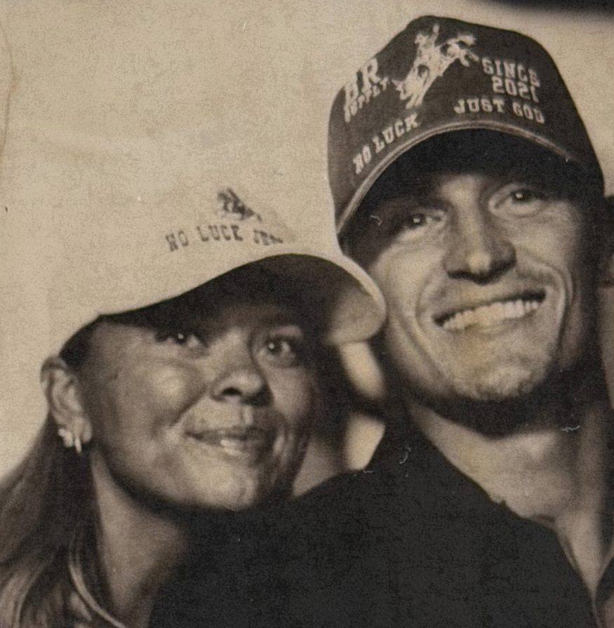 Sepia photo booth portrait of Emma and Jarom Stewart in Bull River Supply caps