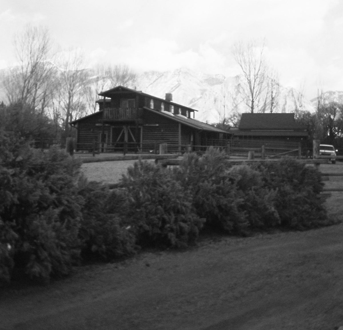 Black and white photo of the Bull River farmhouse and barn in Utah, 2002