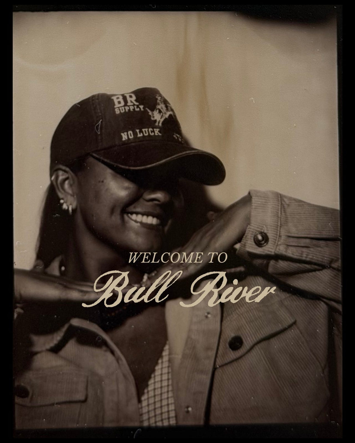 Sepia portrait in a Bull River Supply cap with the words Welcome to Bull River