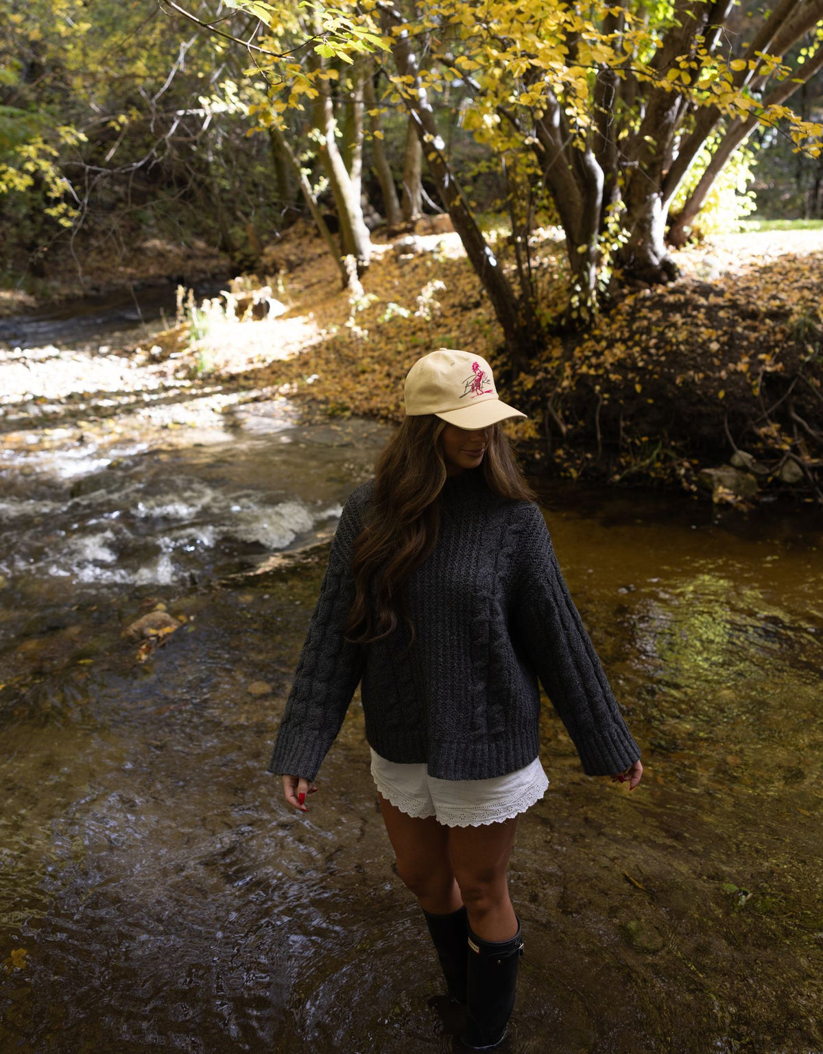 Wearing Bull River caps by a creek